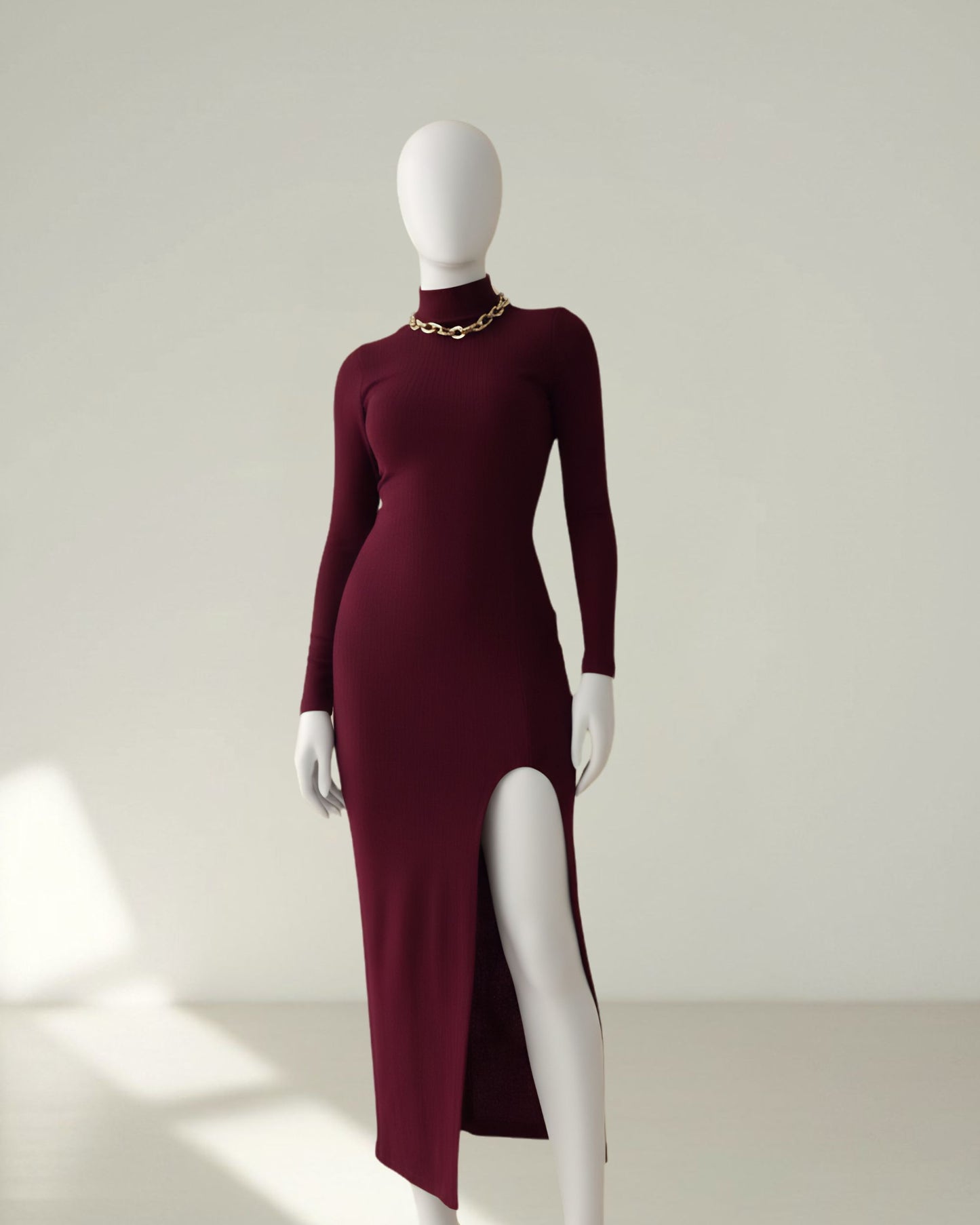 Mid-length bodycon dress with slit and turtleneck